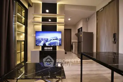 Modern living room with sleek furniture and open kitchen layout