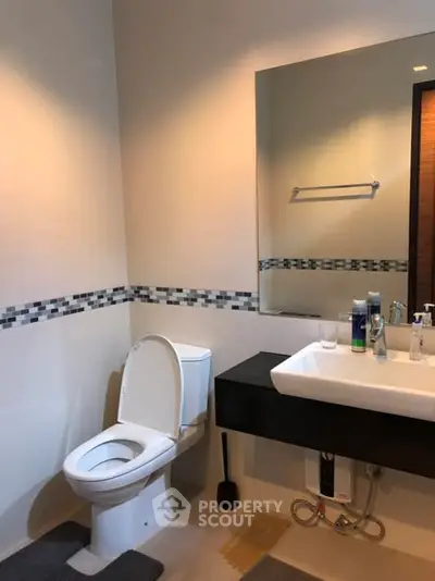 Modern bathroom with sleek fixtures and stylish tile accents