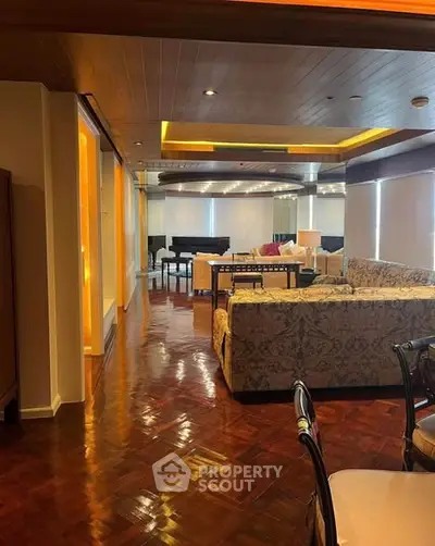 Luxurious living room with elegant decor and grand piano, featuring wooden flooring and ambient lighting.