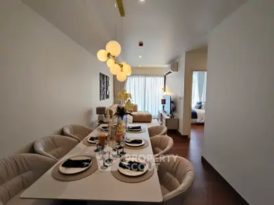 Elegant dining area with modern lighting and cozy seating in a stylish apartment