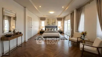 Luxurious bedroom with elegant decor and large windows offering natural light.