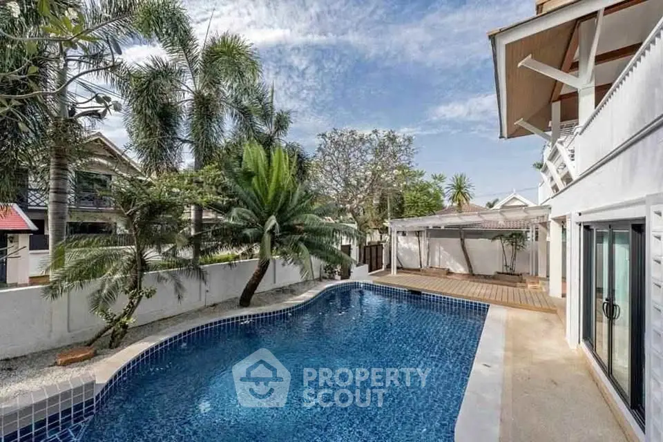 Luxurious villa with private pool and lush tropical garden, perfect for relaxation and entertaining.