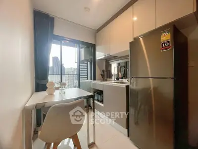 Modern kitchen with sleek appliances and city view, perfect for urban living.