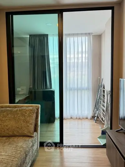 Modern living room with sliding glass door and natural light