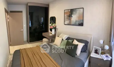 Cozy bedroom with modern decor and stylish furnishings, perfect for relaxation.