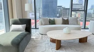 Modern living room with stylish furniture and city view through large windows.
