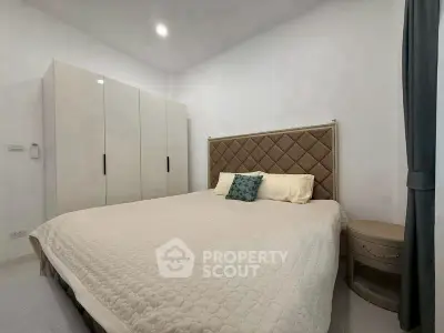 Cozy bedroom with modern decor and spacious wardrobe