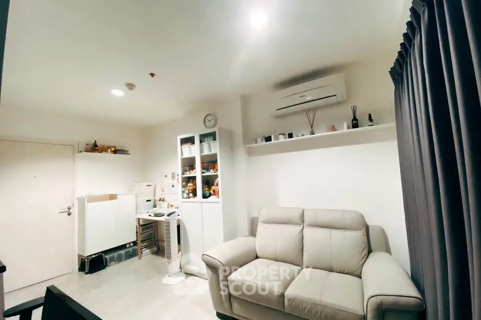 Cozy living room with modern decor and air conditioning
