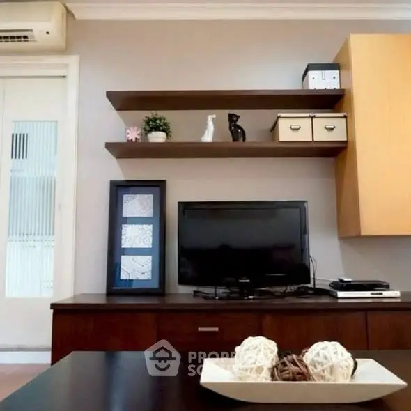 Modern living room with stylish shelving and TV setup