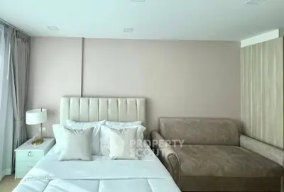 Modern bedroom with elegant decor and comfortable furnishings in a stylish apartment.