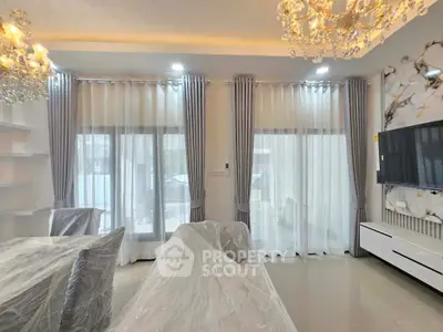 Elegant living room with chandeliers and modern decor