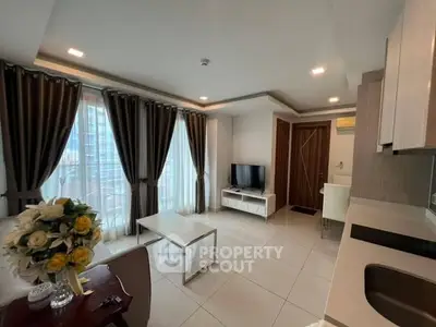 Modern living room with elegant decor and large windows in a stylish apartment.