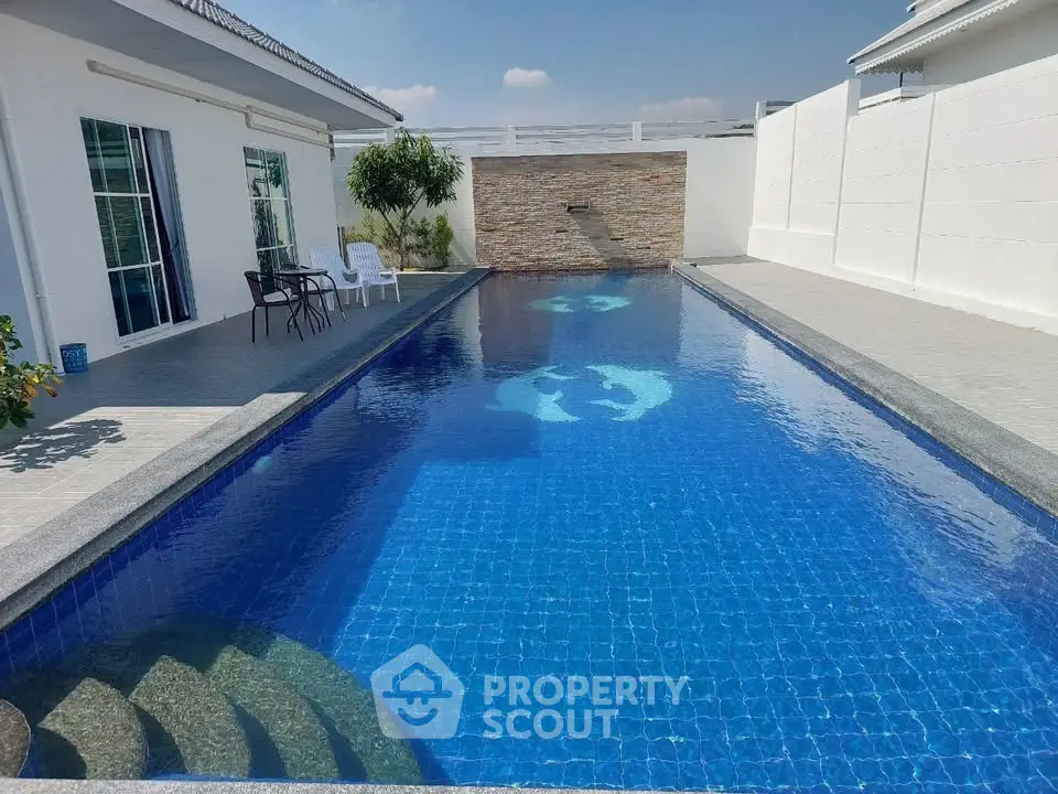 Luxurious private pool with modern design and spacious deck area, perfect for relaxation and entertainment.