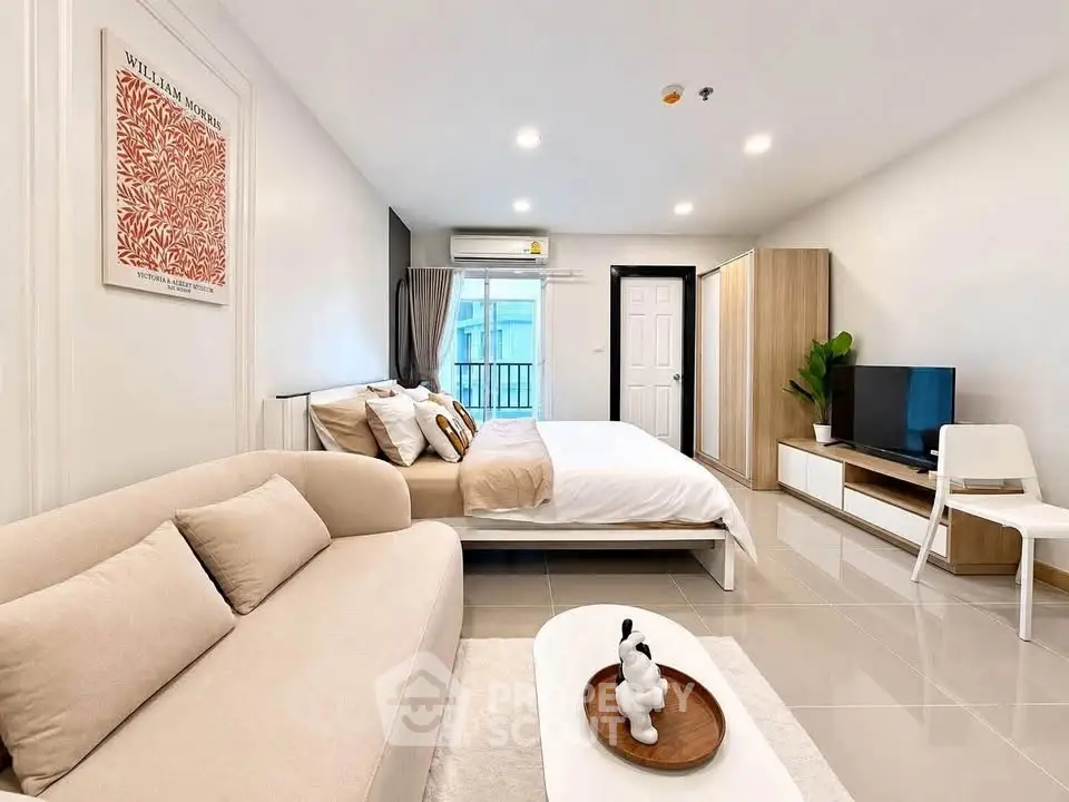 Modern studio apartment with cozy living area and stylish decor