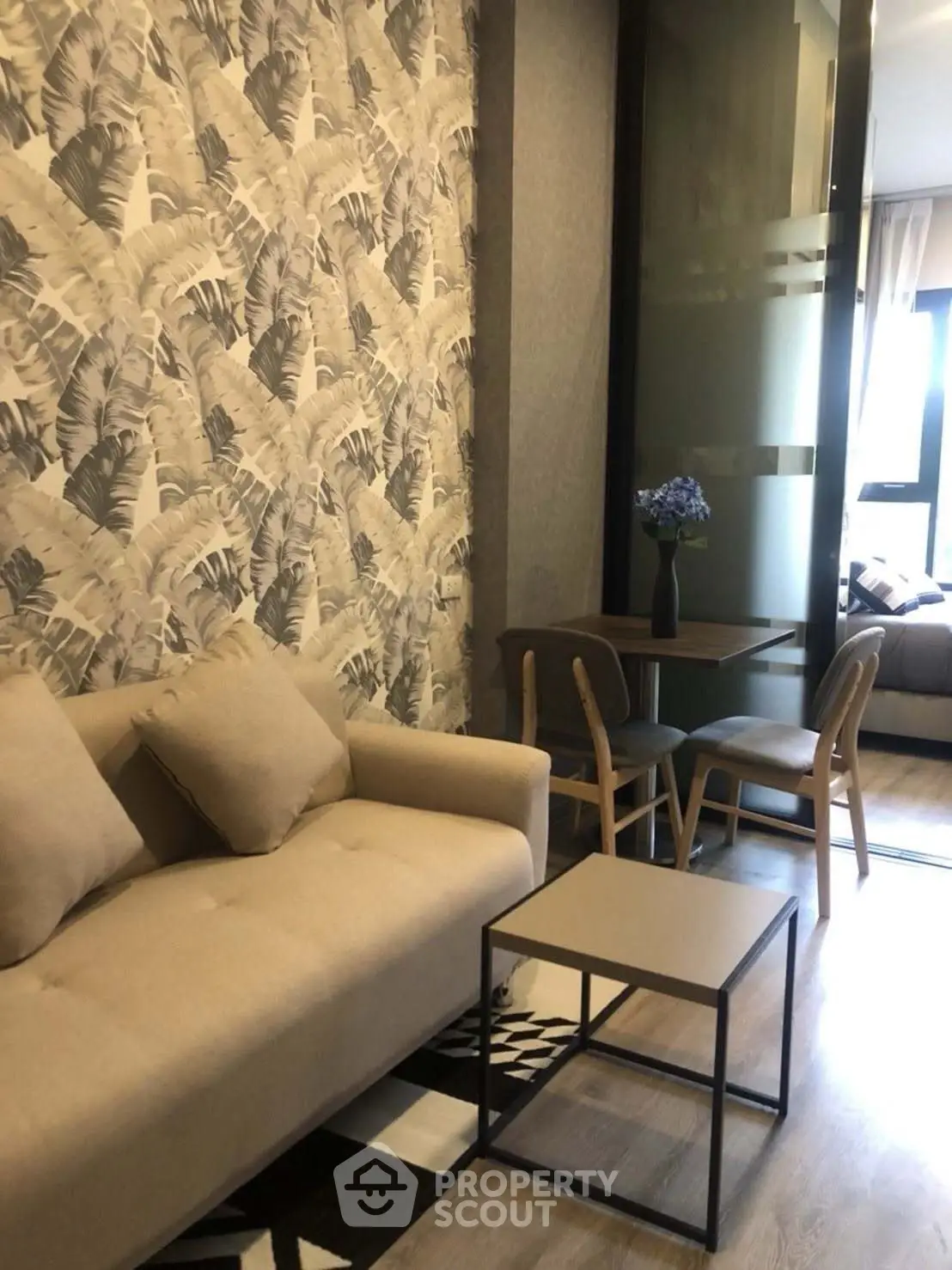 Stylish living room with modern decor and cozy seating area in a contemporary apartment.