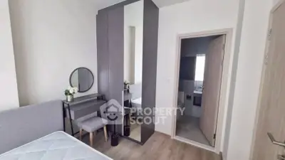 Modern bedroom with stylish vanity and ensuite bathroom