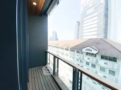 Spacious balcony with city view in modern high-rise building