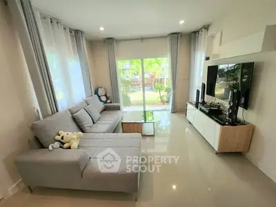 Spacious living room with modern decor and garden view