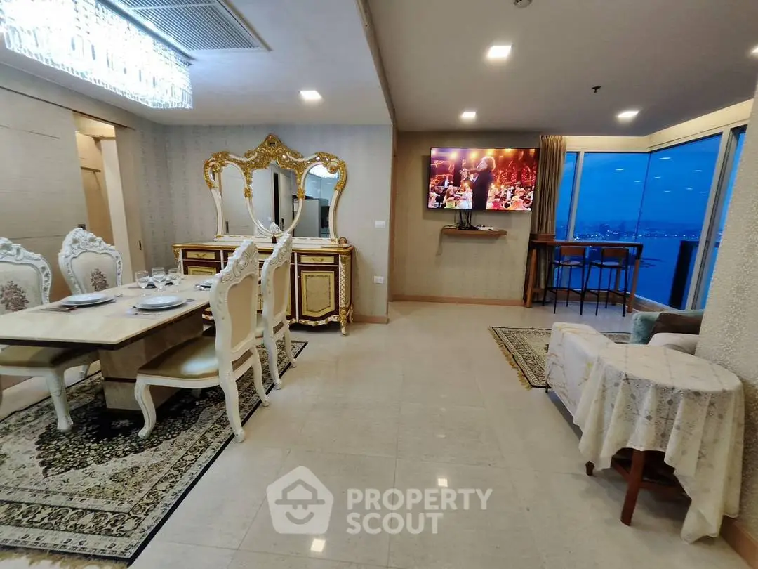 Luxurious dining and living area with elegant furniture and stunning city view.