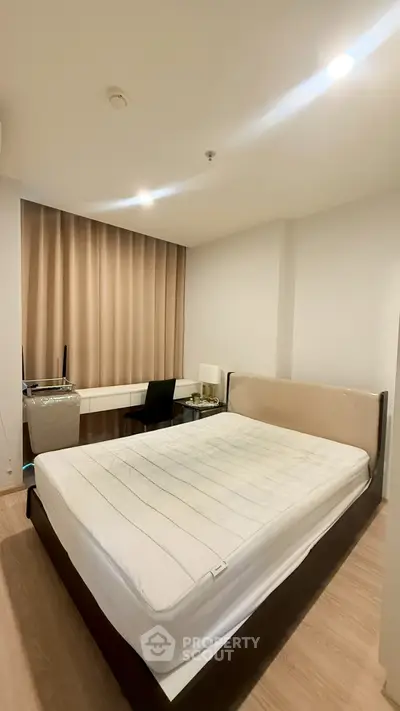 Modern bedroom with minimalist design and ample natural light