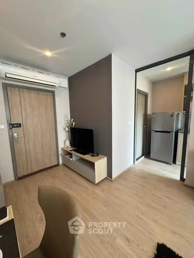 Modern apartment interior with sleek design, featuring a cozy living area and a contemporary kitchen.
