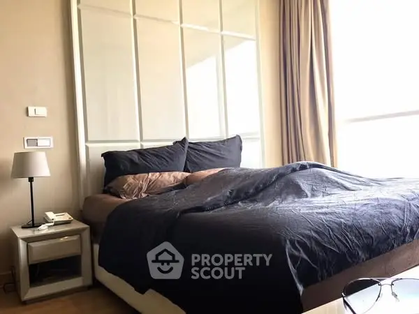Cozy bedroom with natural light and modern decor