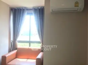 Cozy living room with natural light and air conditioning