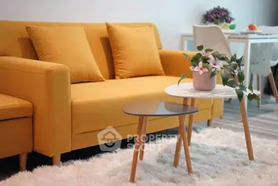 Stylish living room with vibrant yellow sofa and modern decor