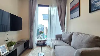 Modern living room with balcony view, featuring a sleek sofa, wall-mounted TV, and elegant decor.