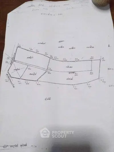 Detailed schematic plan of a property layout with measurements and boundaries.