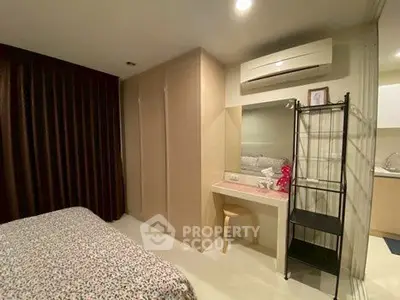 Cozy bedroom with built-in wardrobe and air conditioning unit