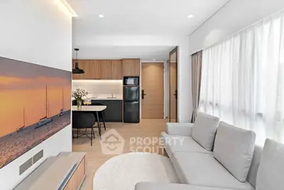 Modern living room with open kitchen and stylish decor