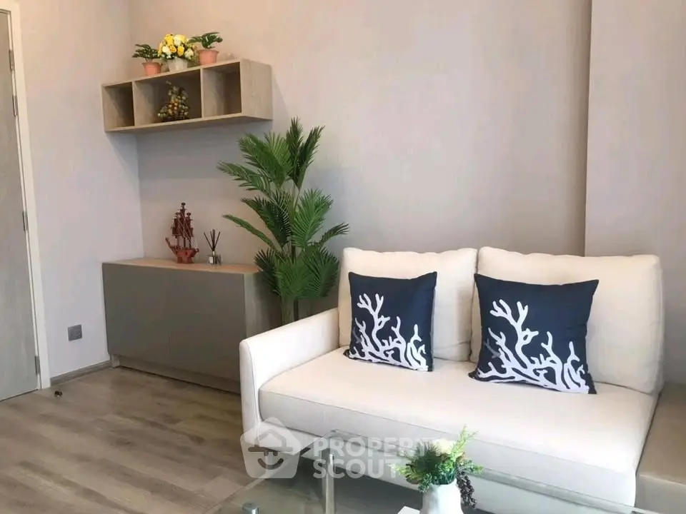 Stylish living room with modern decor and cozy seating in a contemporary apartment.