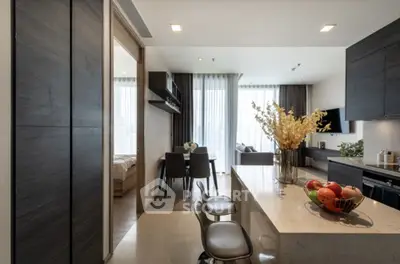 Modern open-layout kitchen with sleek design and natural light