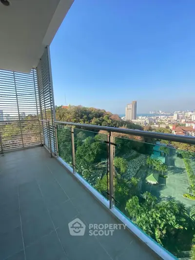 Spacious balcony with stunning city and greenery views, perfect for relaxation and enjoying the outdoors.