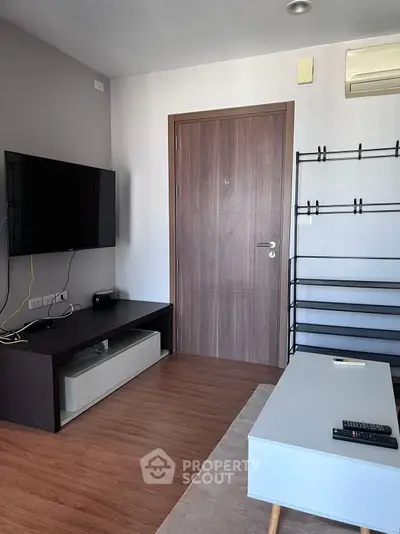 Modern living room with sleek TV setup and stylish furniture