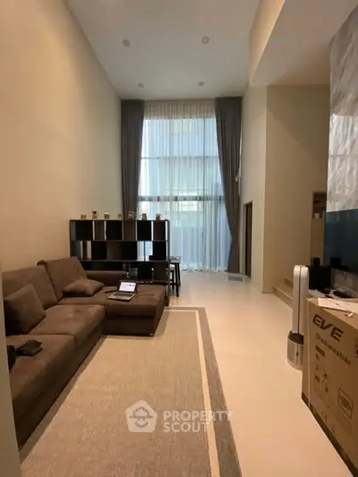 Spacious modern living room with high ceilings and elegant decor