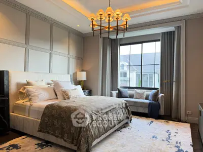Luxurious bedroom with elegant decor and large window view