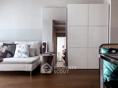 Modern living room with sleek white furniture and stylish decor