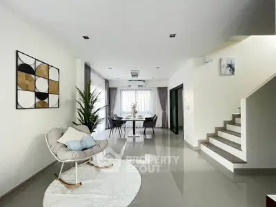 Spacious modern living room with elegant dining area and stylish decor