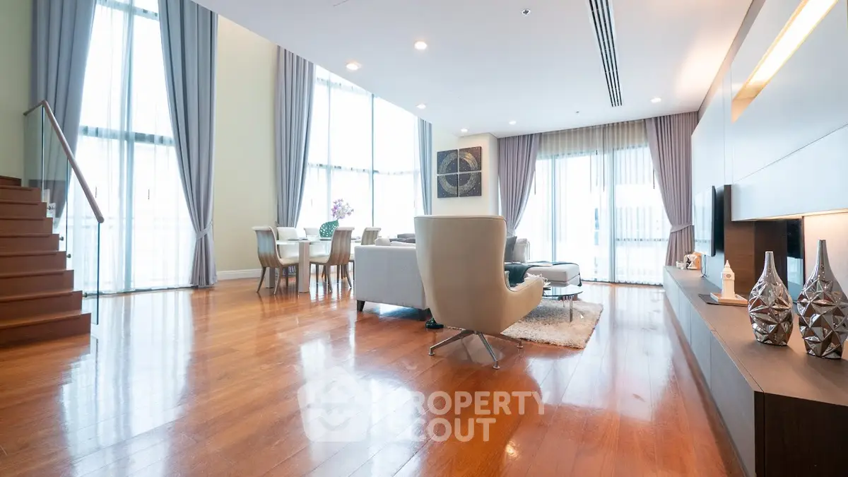 Spacious modern living room with high ceilings and elegant decor