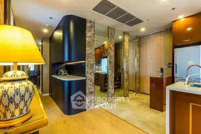 Luxurious modern kitchen with sleek design and high-end appliances in a stylish apartment.