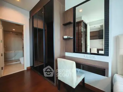 Modern bedroom with elegant wooden wardrobe and stylish vanity area