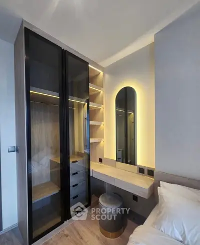 Modern bedroom with sleek wardrobe and stylish vanity area