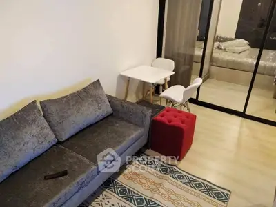 Modern living room with stylish gray sofa and cozy decor