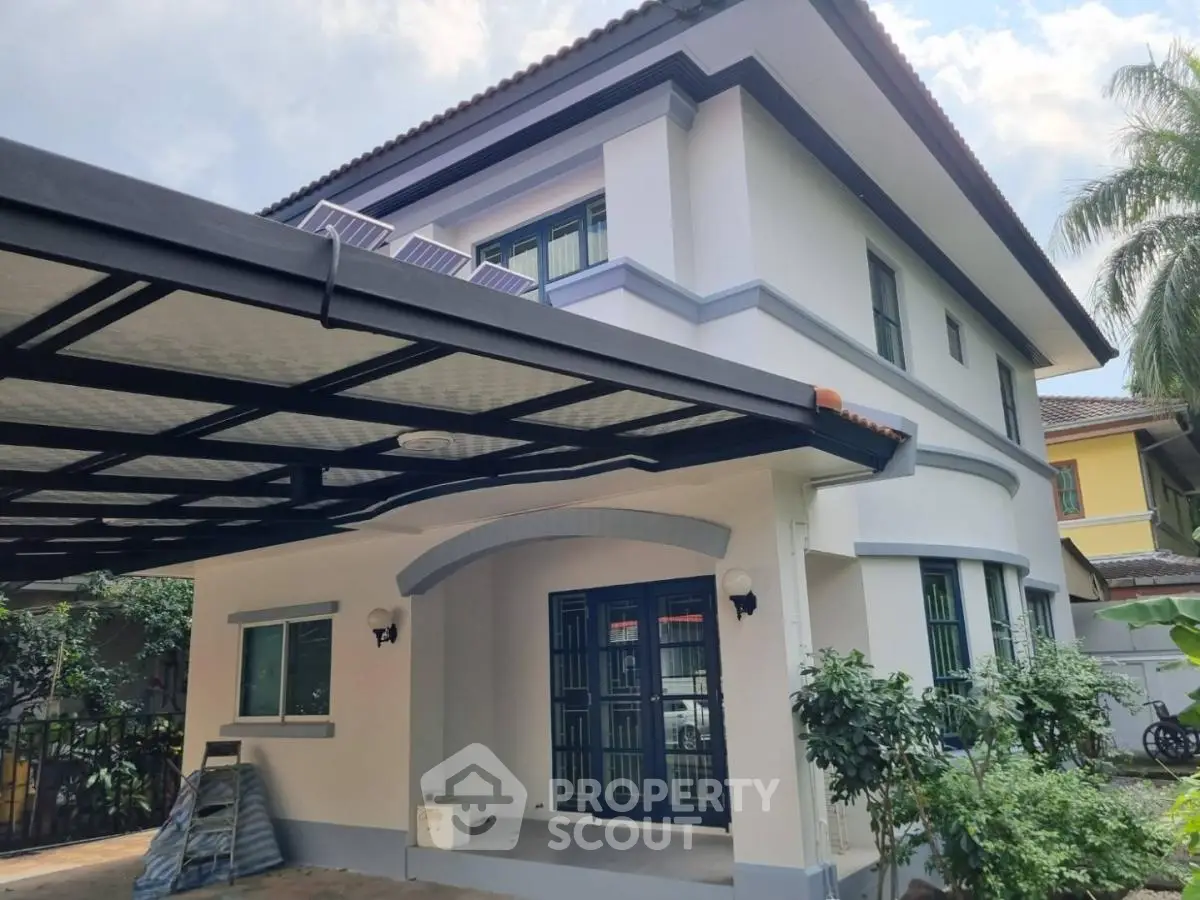 Charming two-story house with modern design and spacious carport