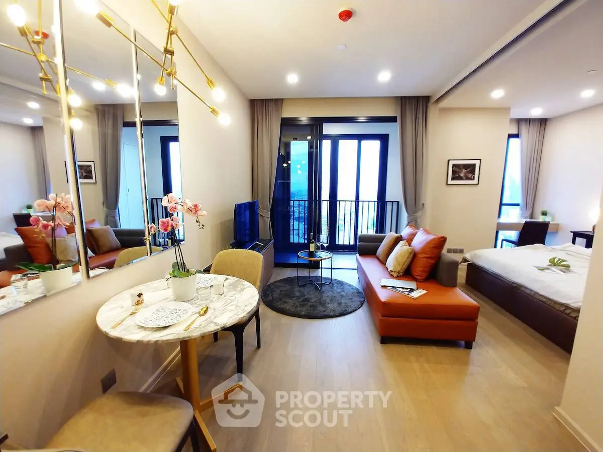 Luxurious open-plan living room with modern decor and balcony view
