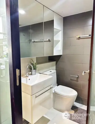 Modern bathroom with sleek fixtures and ample storage space