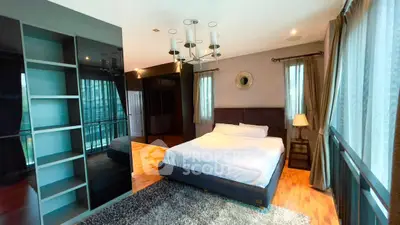 Luxurious bedroom with modern design and ample natural light