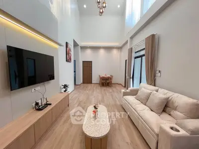 Spacious modern living room with high ceilings and elegant decor